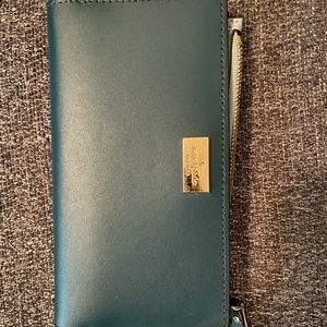 Kate Spade dark blue / teal with light blue inside.